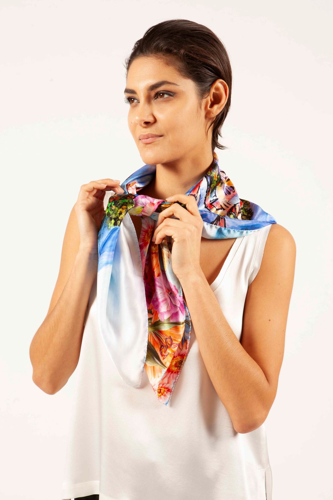 Hand-painted silk scarf knotted at the neck